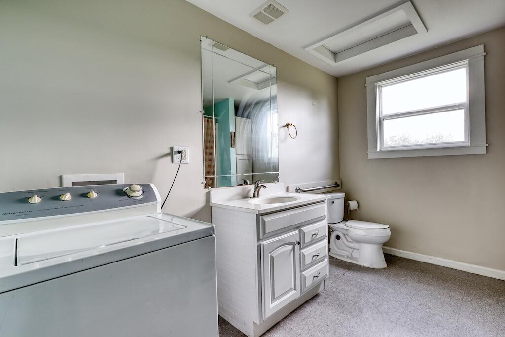 1011 Wilson Cemetery Road Northeast Check, VA 24072 - Photo 24 of 41 a bathroom with a toilet sink and mirror