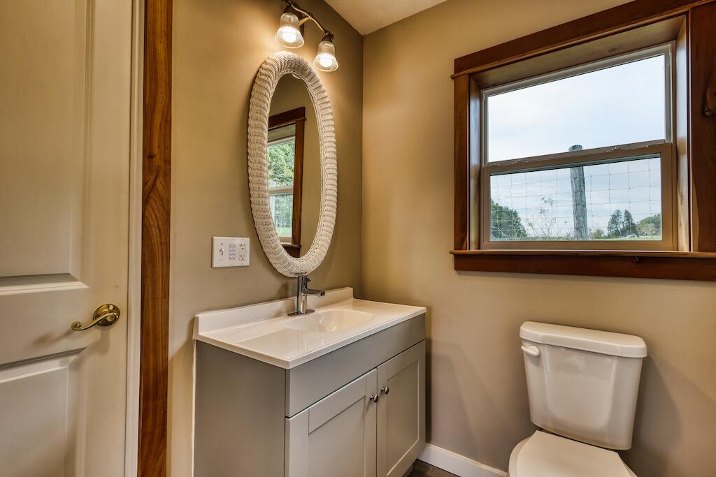 1011 Wilson Cemetery Road Northeast Check, VA 24072 - Photo 29 of 41 a bathroom with a toilet sink and mirror