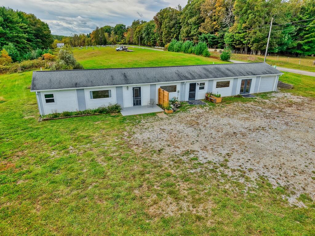 1011 Wilson Cemetery Road Northeast Check, VA 24072 - Photo 3 of 41 a front view of a house with yard and green space