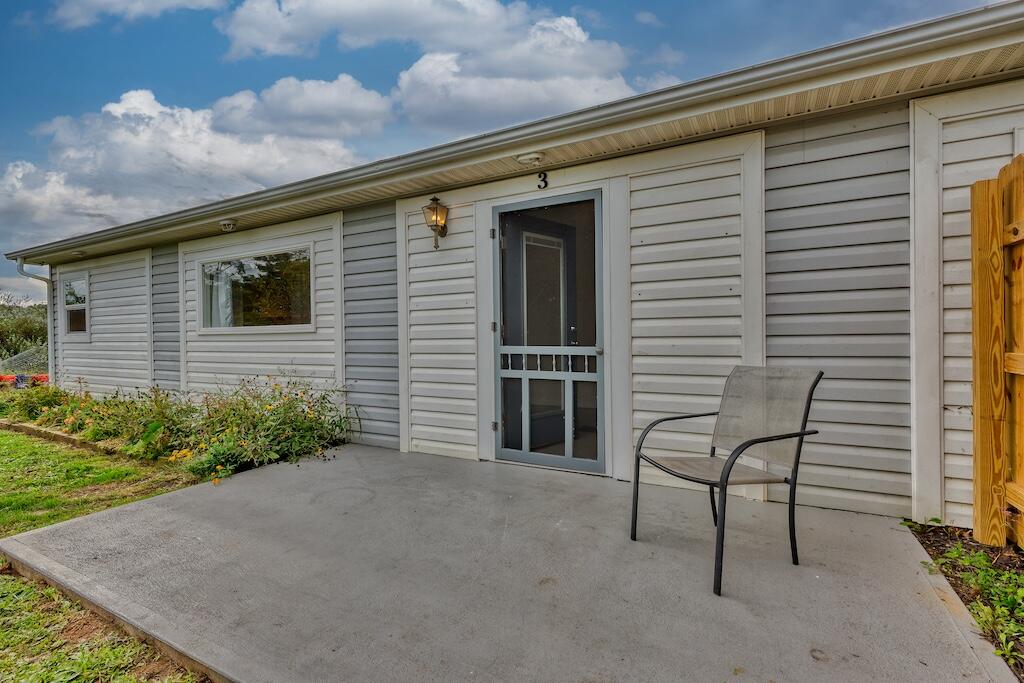 1011 Wilson Cemetery Road Northeast Check, VA 24072 - Photo 31 of 41 a view of backyard with seating space and wooden fence