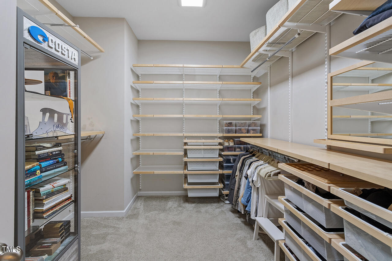1616 Upper Park Road Wake Forest, NC 27587 - Photo 14 of 20 a view of walk in closet with clothes and shoes
