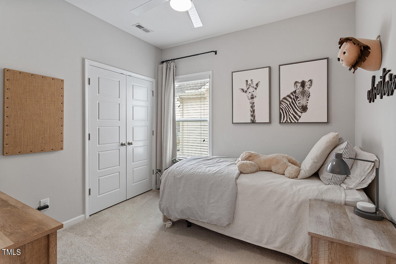 1616 Upper Park Road Wake Forest, NC 27587 - Photo 16 of 20 a bedroom with a bed and painting on the wall