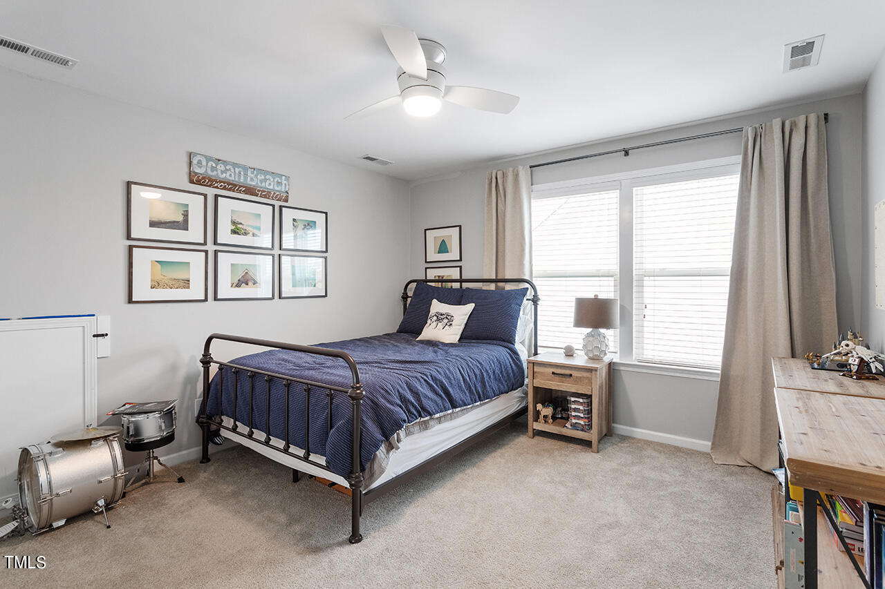 1616 Upper Park Road Wake Forest, NC 27587 - Photo 19 of 20 a bed room with a bed and a tv