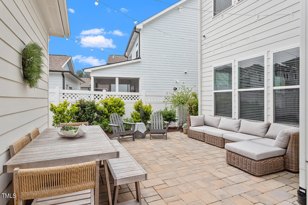 1616 Upper Park Road Wake Forest, NC 27587 - Photo 3 of 20 a view of a patio with couches table and chairs and potted plants