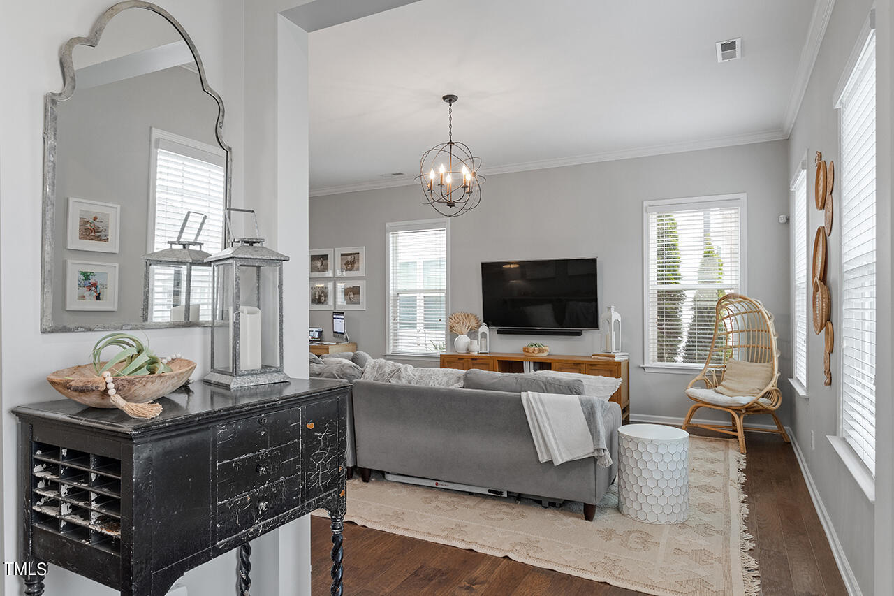 1616 Upper Park Road Wake Forest, NC 27587 - Photo 4 of 20 a living room with furniture and a flat screen tv