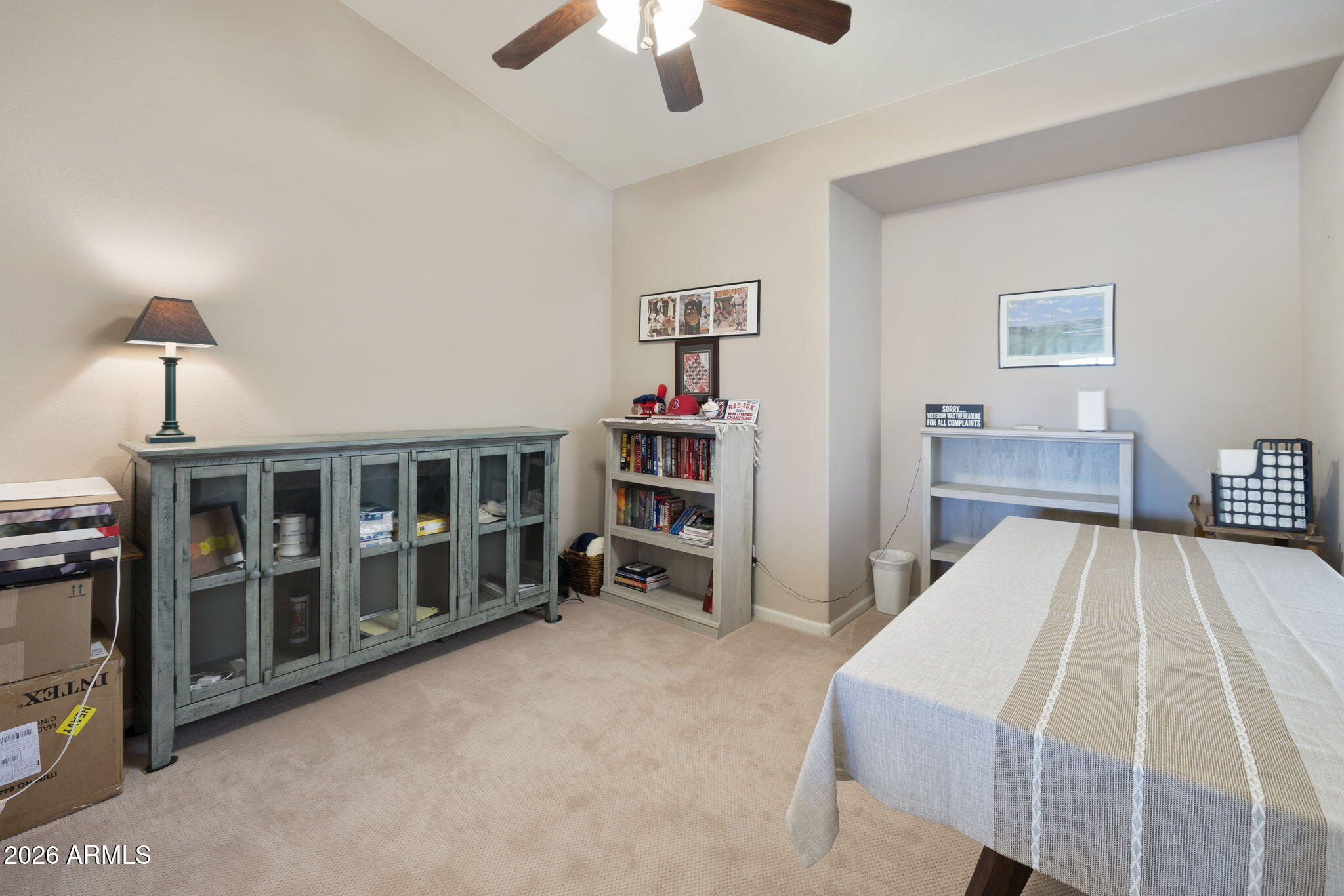 12435 West Monte Vista Road Avondale, AZ 85392 - Photo 15 of 69 a bed room with a bed and a book shelf