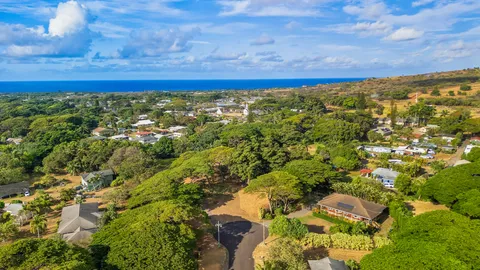a view of a field with an ocean