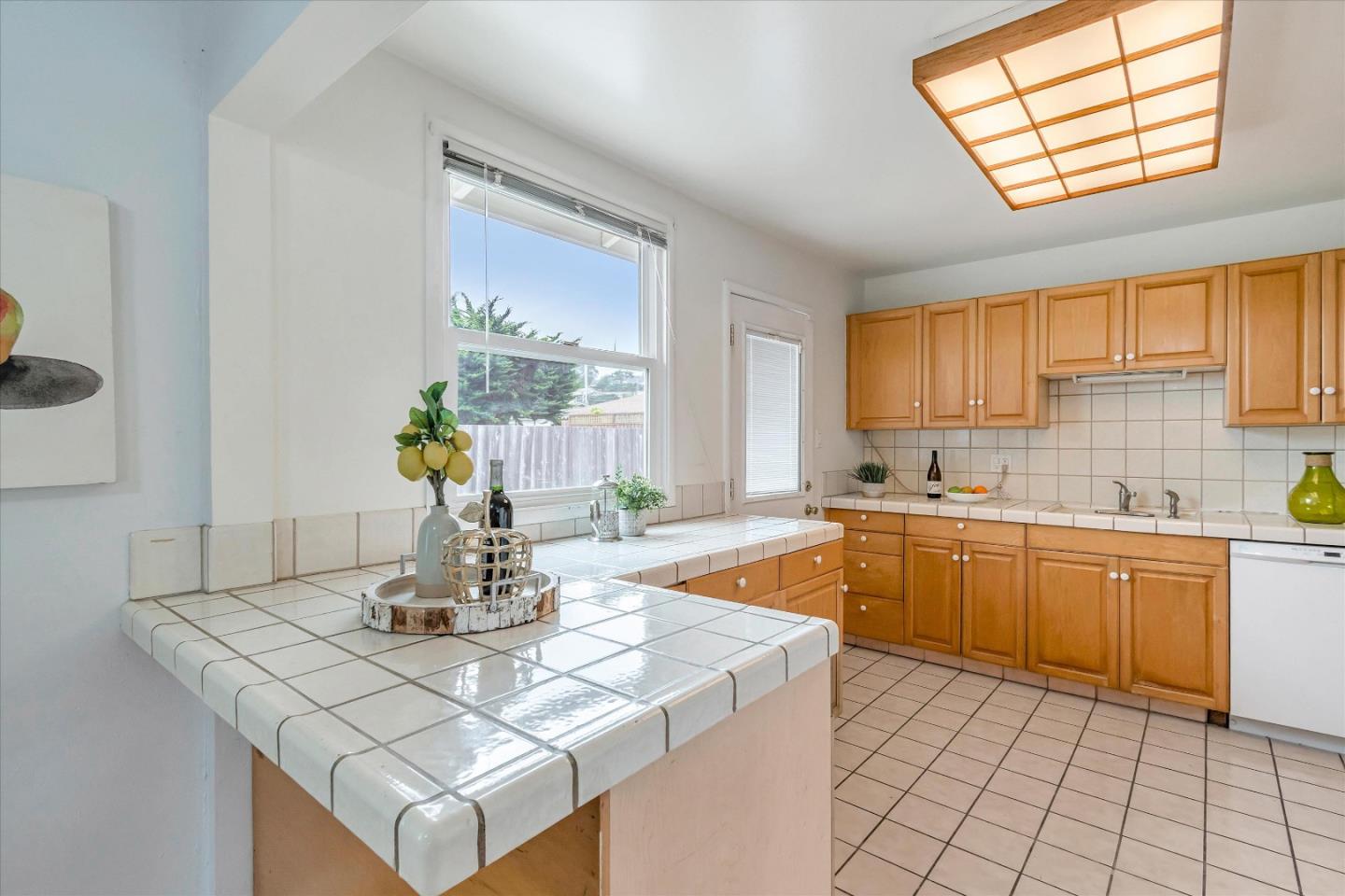1159 De Solo Drive Pacifica, CA 94044 - Photo 12 of 45 a kitchen with a sink cabinets and window