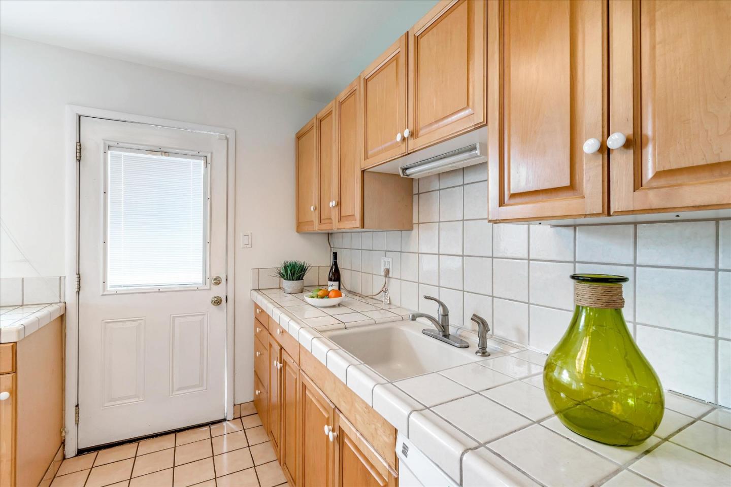 1159 De Solo Drive Pacifica, CA 94044 - Photo 15 of 45 a kitchen with a sink a cabinets and window