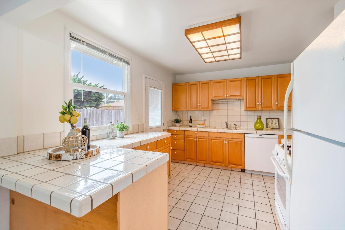 1159 De Solo Drive Pacifica, CA 94044 - Photo 21 of 45 a kitchen with a sink appliances and a counter top space
