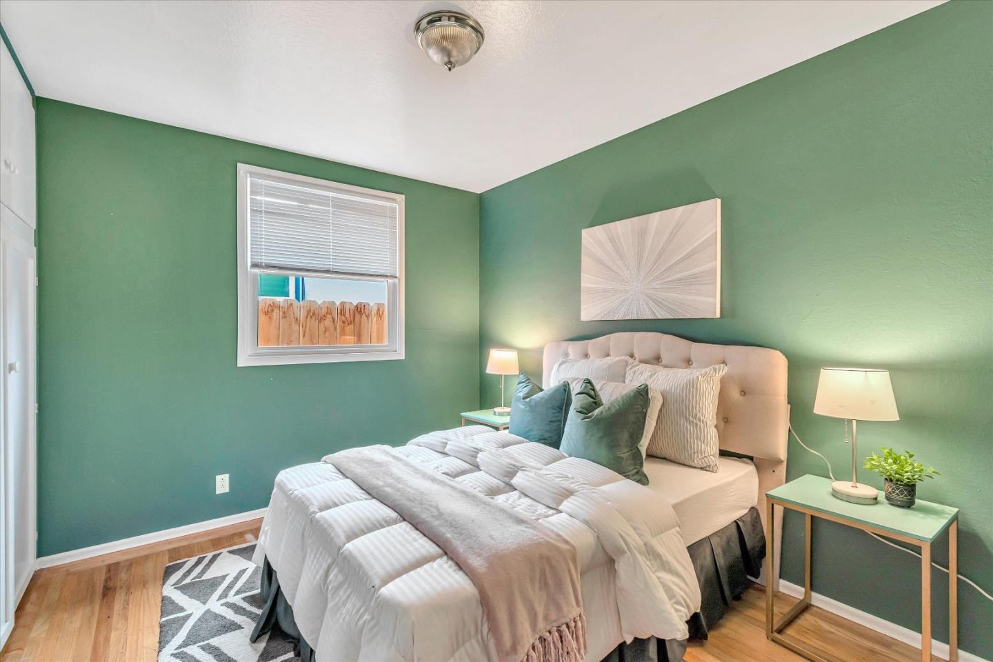 1159 De Solo Drive Pacifica, CA 94044 - Photo 26 of 45 a bedroom with a bed and a window