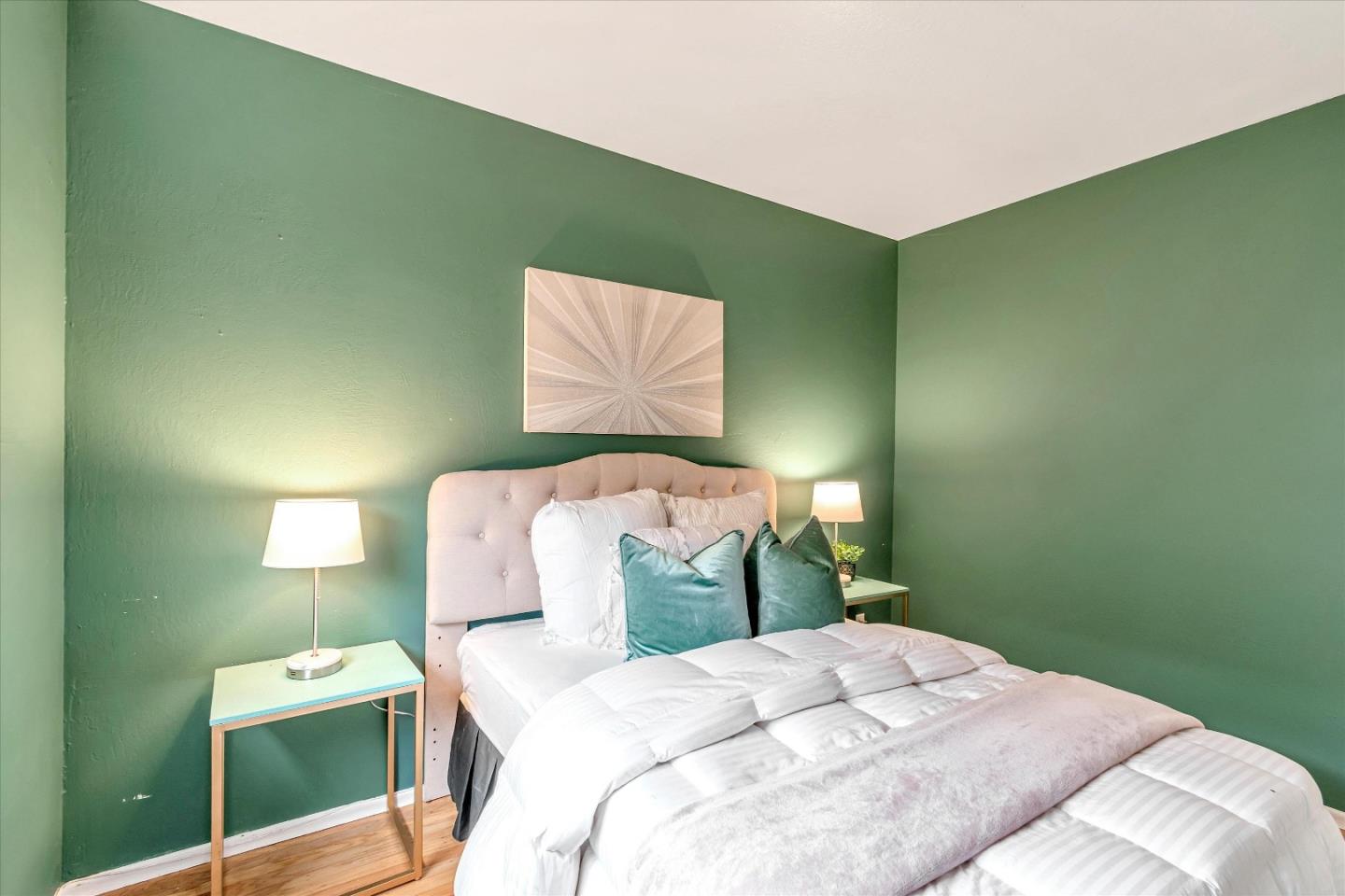 1159 De Solo Drive Pacifica, CA 94044 - Photo 27 of 45 a bedroom with a bed and a painting on the wall