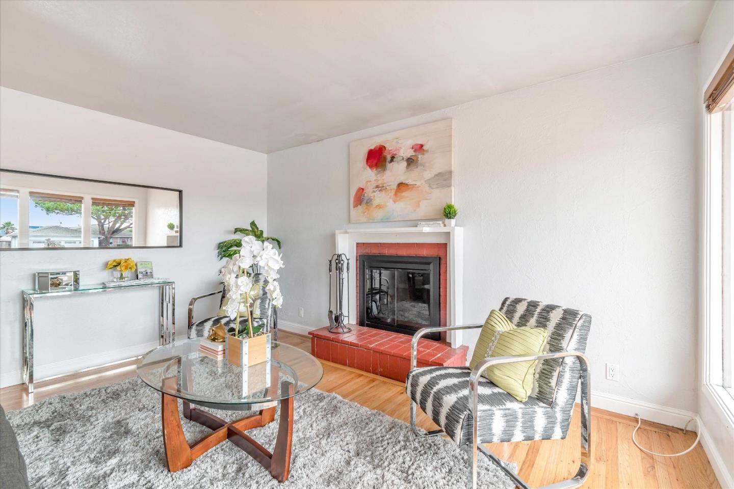 1159 De Solo Drive Pacifica, CA 94044 - Photo 4 of 45 a living room with furniture and a fireplace