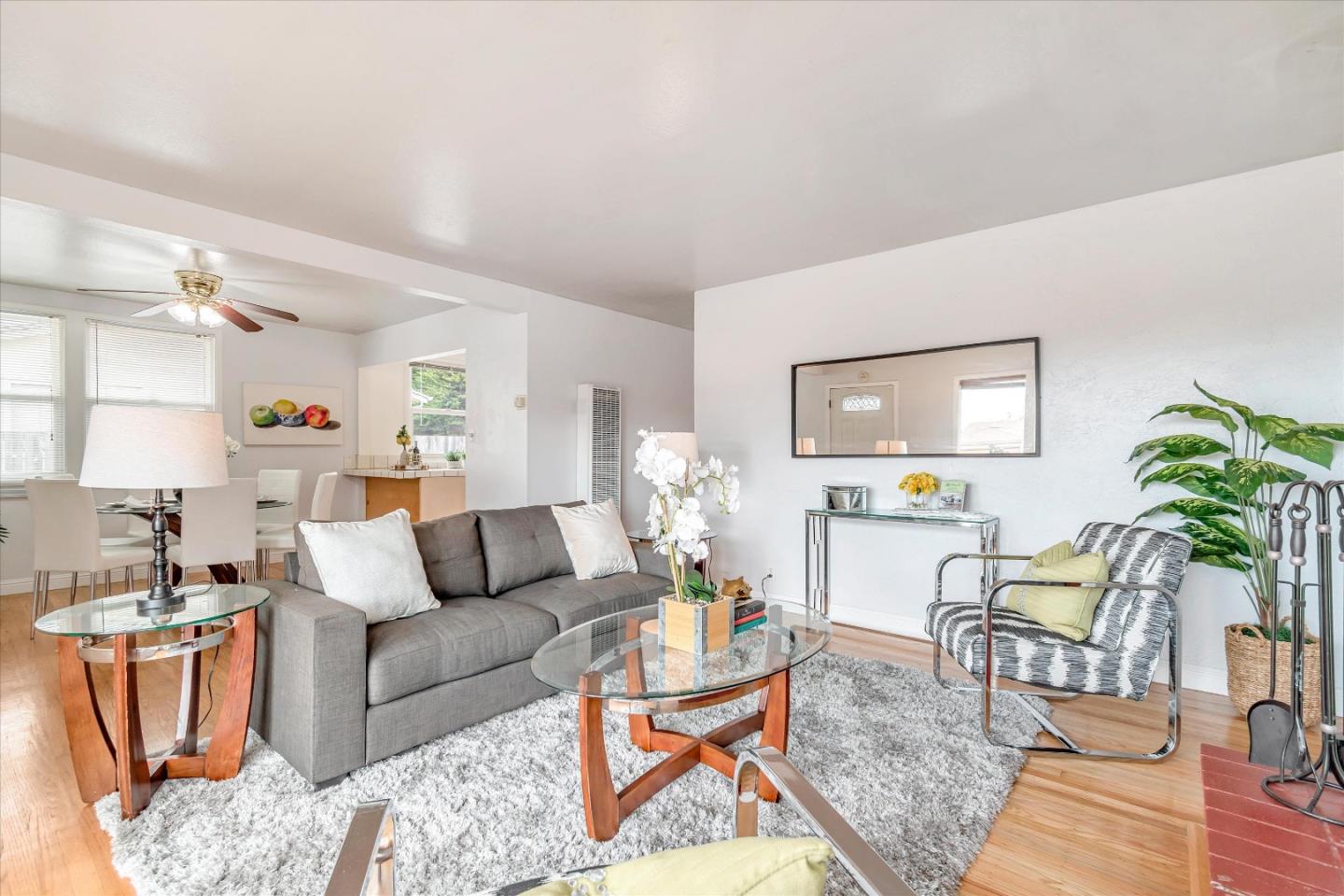 1159 De Solo Drive Pacifica, CA 94044 - Photo 5 of 45 a living room with furniture a chandelier and a potted plant