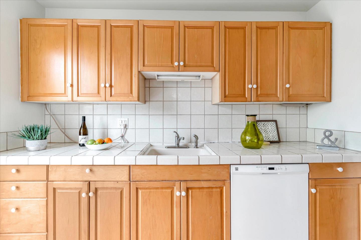 1159 De Solo Drive Pacifica, CA 94044 - Photo 9 of 45 a kitchen with a sink cabinets and appliances