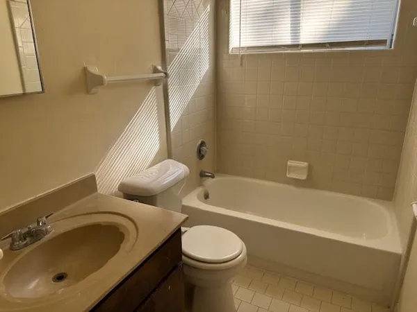 a bathroom with a toilet sink and bathtub