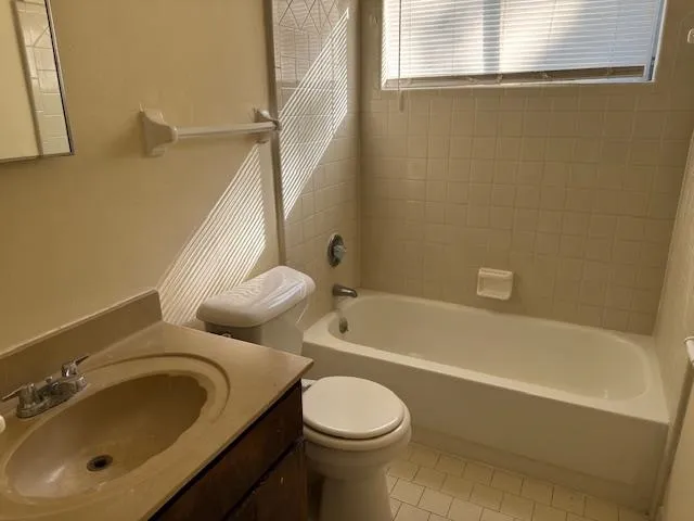 a bathroom with a toilet sink and bathtub