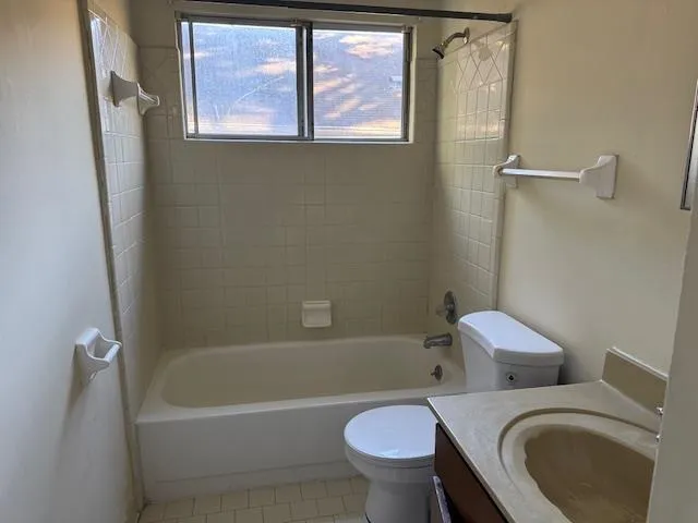 a white bath tub sitting next to a toilet