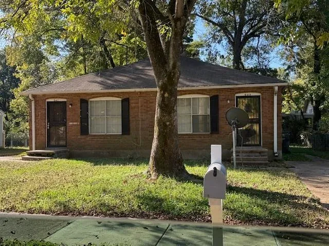 front view of house with a yard