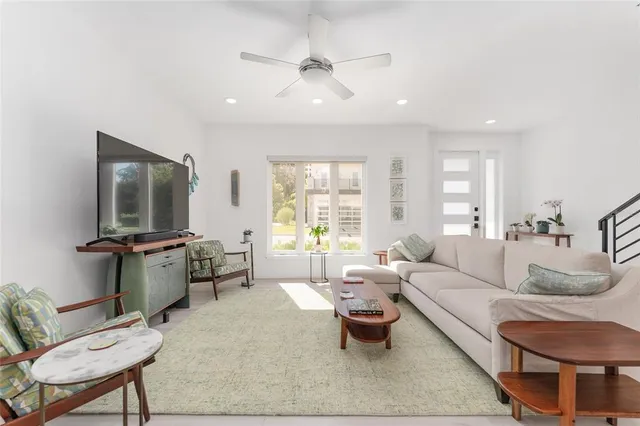 a living room with furniture and a large window