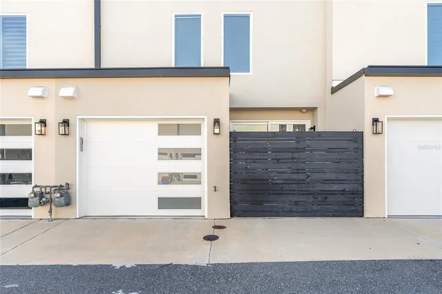 a view of swimming pool with seating space and palm tree