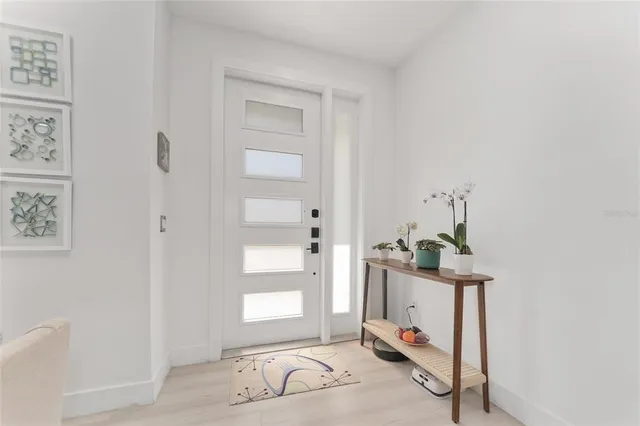 a view of a hallway with front door