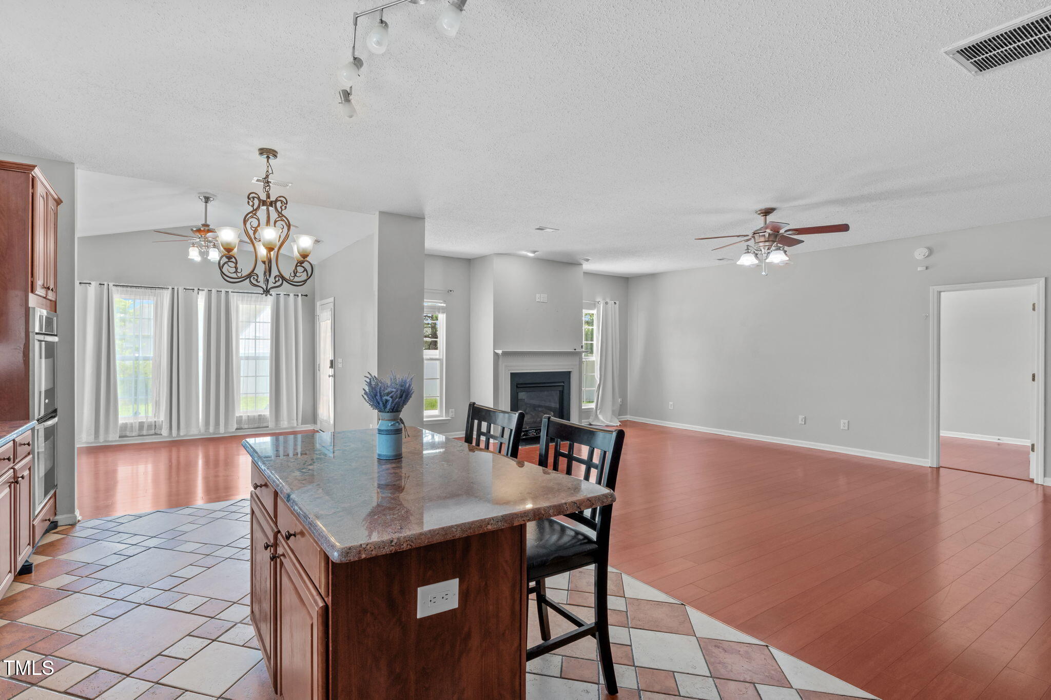 760 Stackhurst Way Wake Forest, NC 27587 - Photo 15 of 37 a view of a dining room with furniture and chandelier