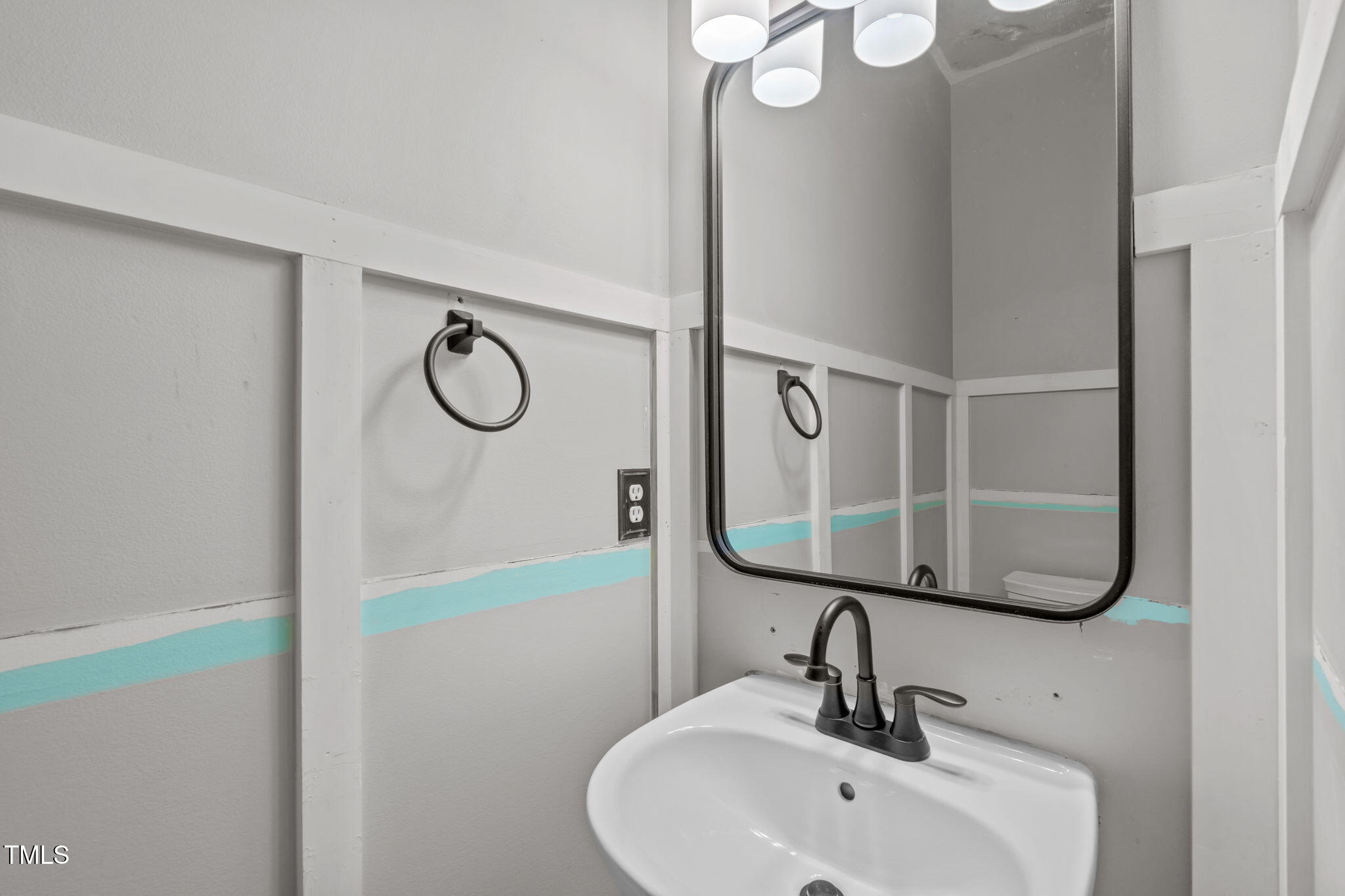 760 Stackhurst Way Wake Forest, NC 27587 - Photo 10 of 37 a bathroom with a sink and mirror