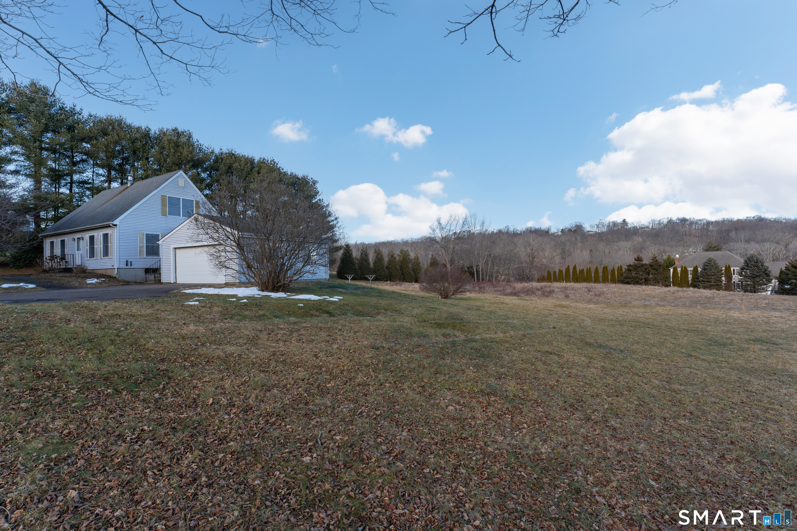 250 Elm Street Guilford, CT 06437 - Photo 25 of 25 a view of a house with a yard