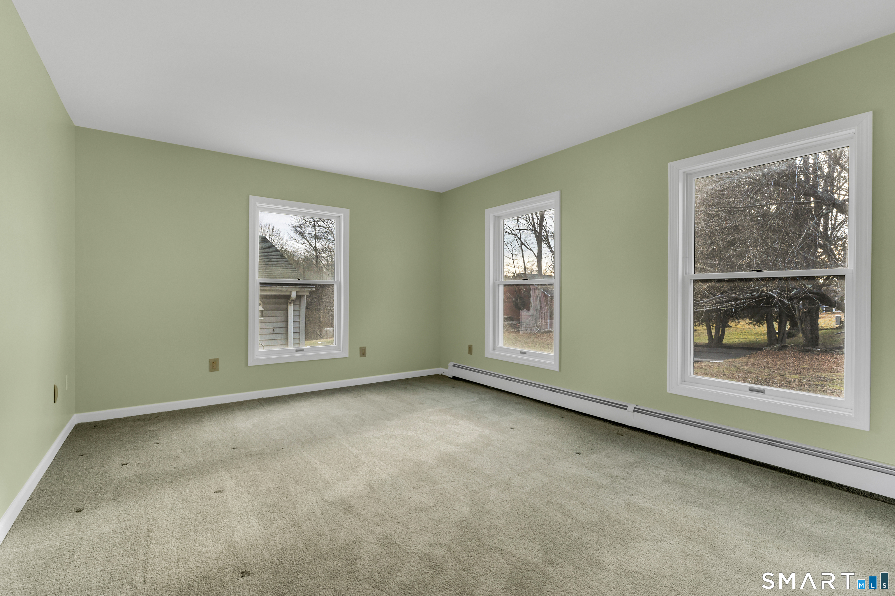 250 Elm Street Guilford, CT 06437 - Photo 3 of 25 an empty room with windows