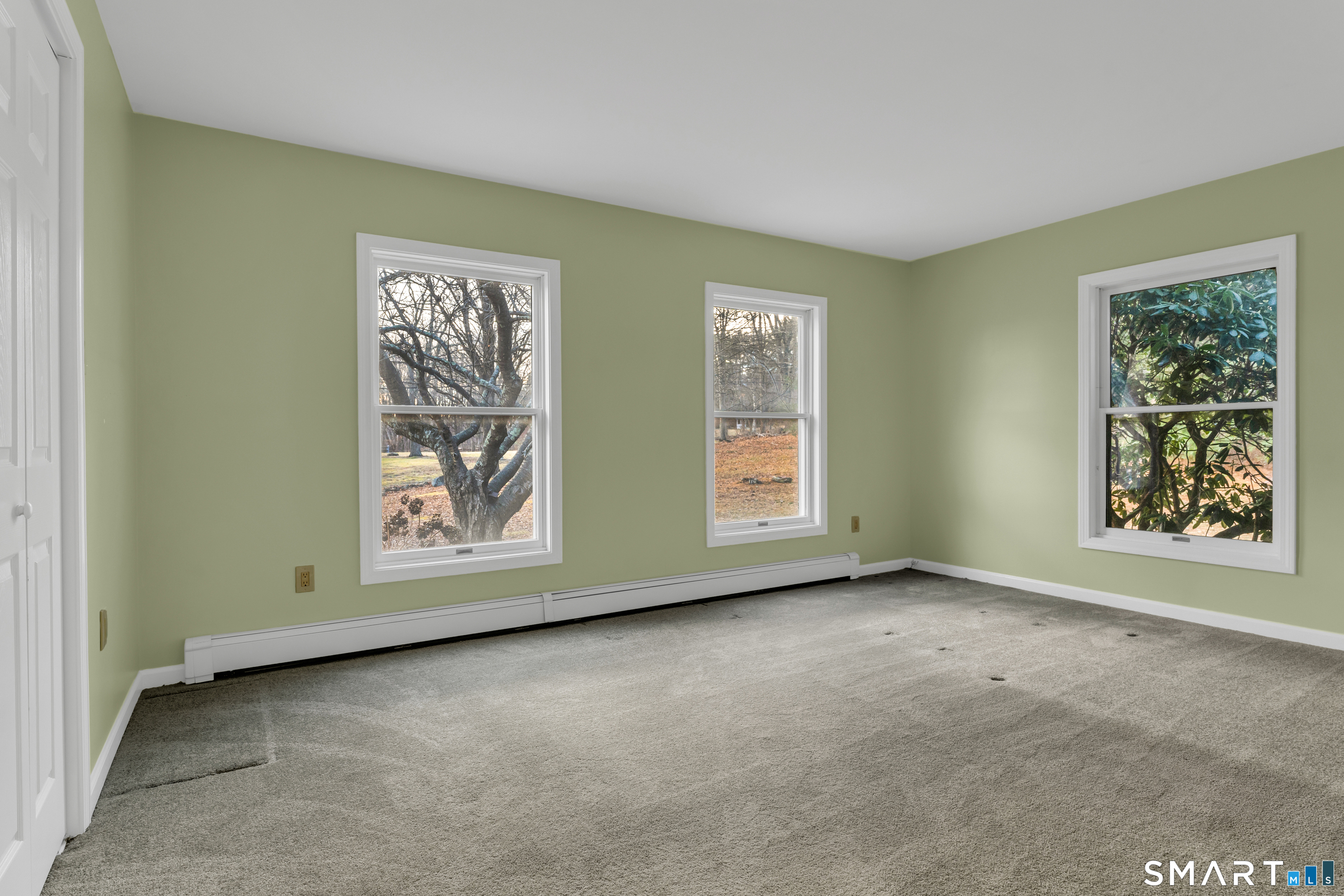 250 Elm Street Guilford, CT 06437 - Photo 10 of 25 an empty room with windows and closet