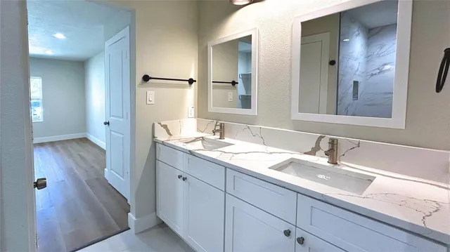a bathroom with a sink and a mirror