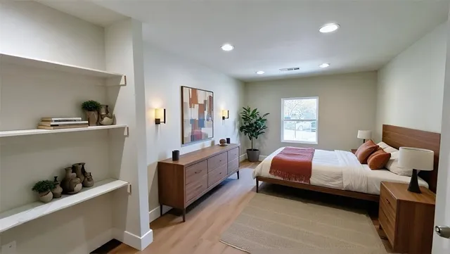 a bedroom with a bed and a window