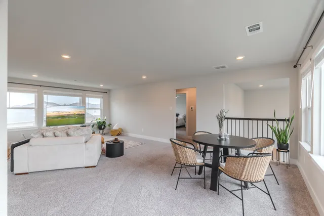 a living room with furniture and a table