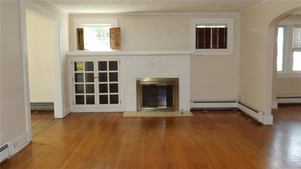 887 Quarry Place Sharon, PA 16146 - Photo 5 of 15 an empty room with windows and fireplace