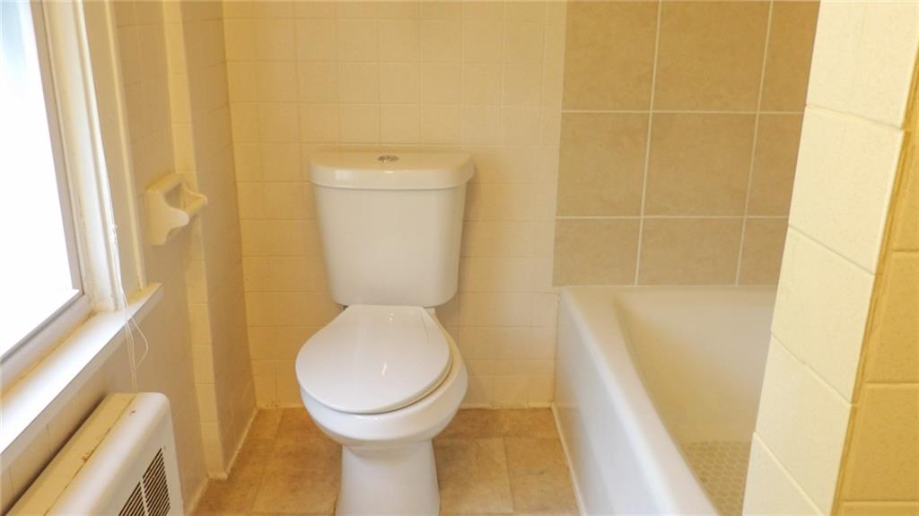 887 Quarry Place Sharon, PA 16146 - Photo 8 of 15 a bathroom with a toilet and a shower