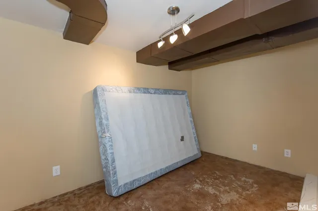 an empty room with a ceiling fan