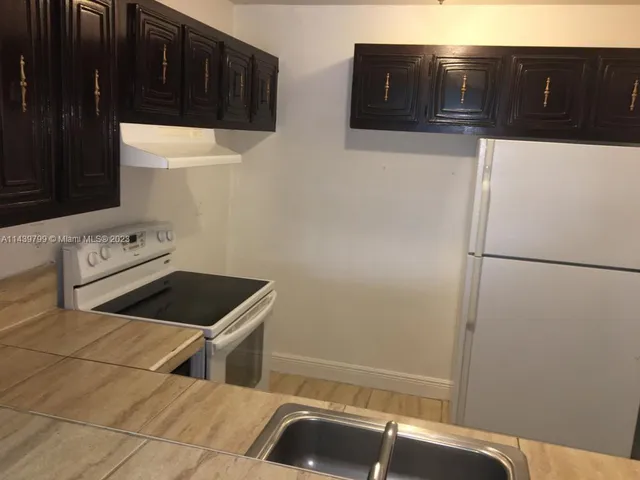$199,000 | 498 Northwest 165th Street, Unit D205, Miami, FL 33169