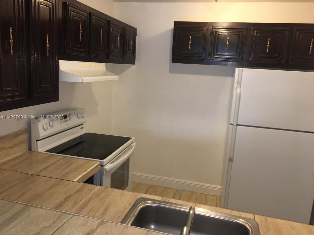 498 Northwest 165th Street, Unit D205 Miami, FL 33169 - Photo 2 of 18