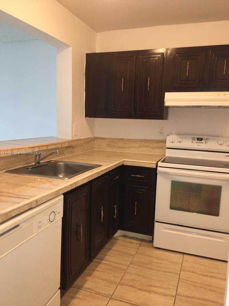 498 Northwest 165th Street, Unit D205 Miami, FL 33169 - Photo 4 of 18
