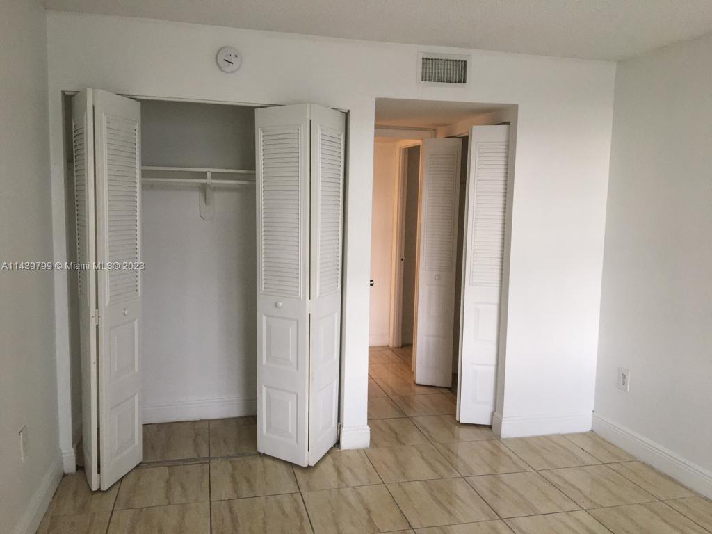 498 Northwest 165th Street, Unit D205 Miami, FL 33169 - Photo 9 of 18