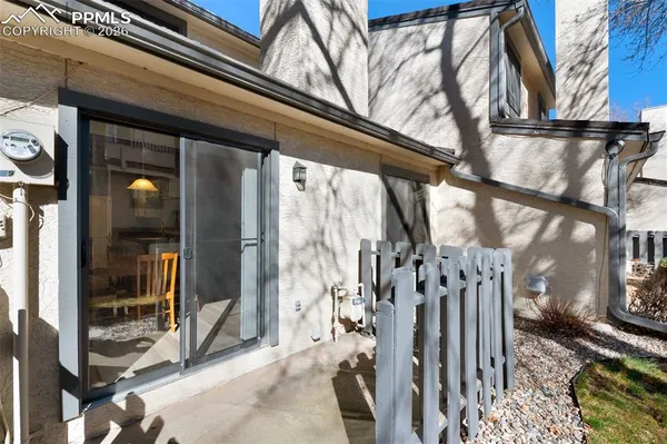 a view of a house with a wooden deck