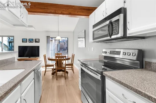 a kitchen with a stove and a microwave