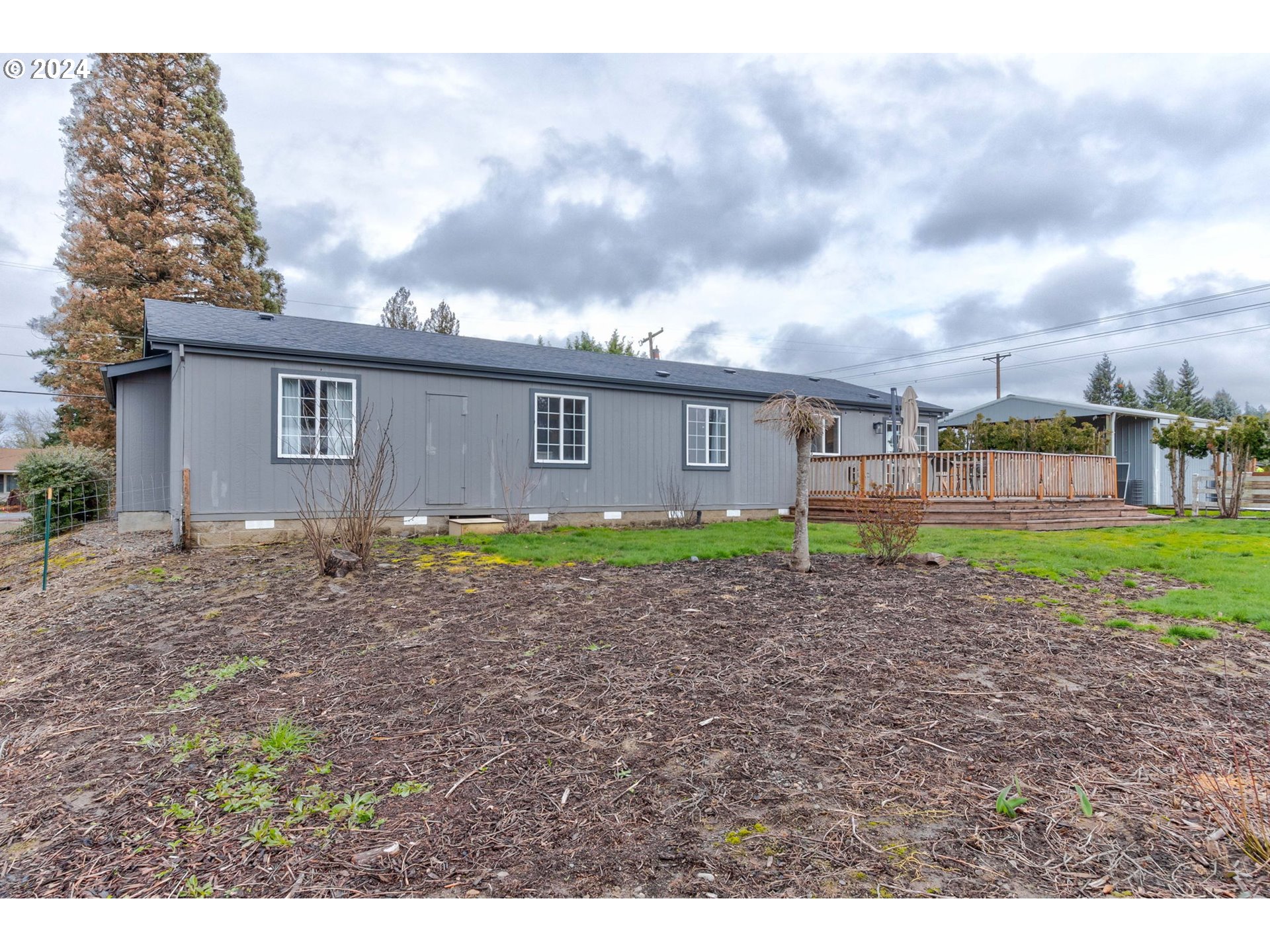 22120 Southwest Riggs Road Beaverton, OR 97078 - Photo 25 of 35 a view of a house with a backyard