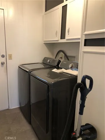 a bedroom with a bed and a mirror on dresser