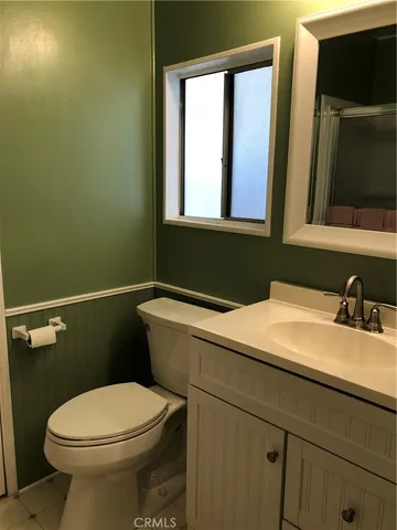 a bathroom with a sink and toilet