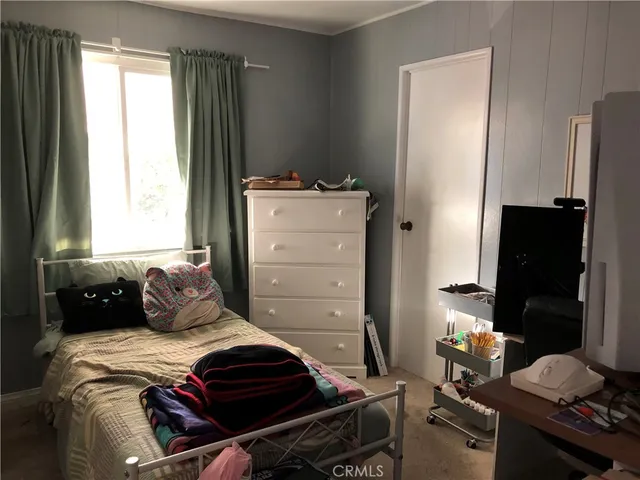 a bathroom with a sink a mirror and shower