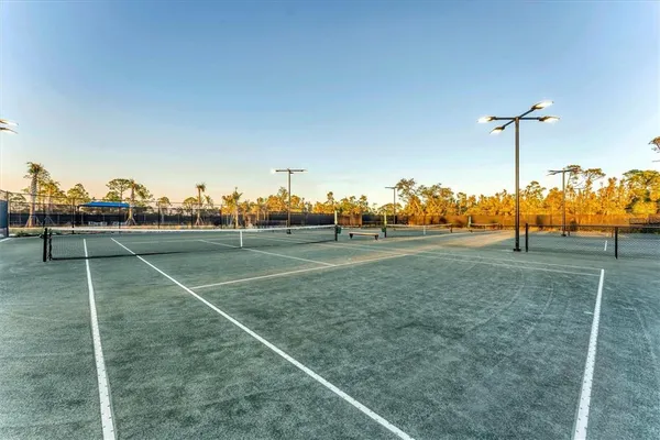 a view of an outdoor space and basketball court
