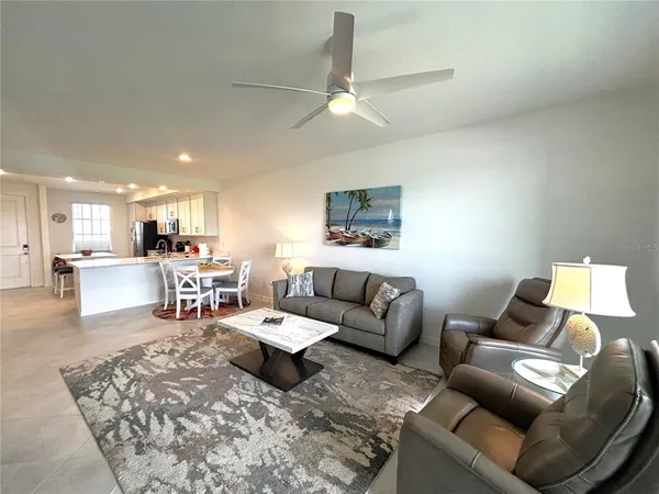 a living room with furniture and white walls