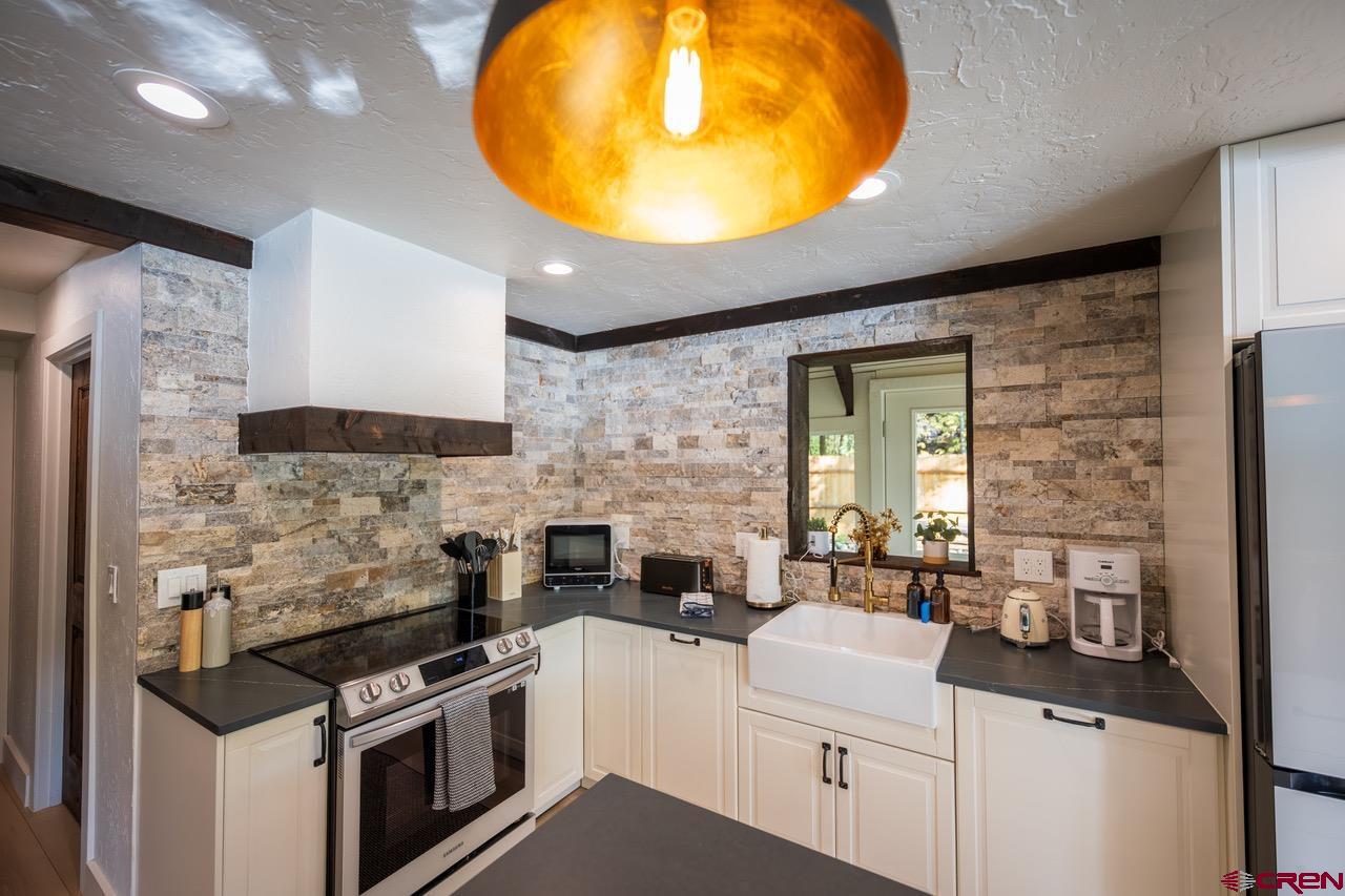 170 Lower Allen Road Crested Butte, CO 81224 - Photo 9 of 42 a kitchen with a stove and a sink